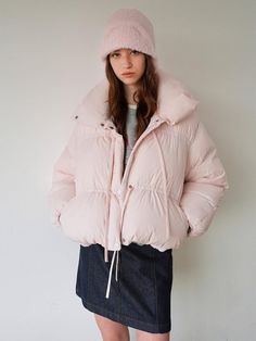 The Ribbon Short Down is a fashion-forward crop-length padded jacket featuring elegant shirring details and functional ribbon accents, available in Light Pink with secure zip and snap button closures. This premium piece is crafted with RDS-certified down fill (80% down, 20% feather) offering superior 600FP warmth retention and insulation properties. The versatile design includes a high-neck collar for added warmth and pairs effortlessly with both skirts and pants, while requiring careful mainten Coquette Winter, Pink Puffer Jacket, Puffer Parka, Greyish Blue, Padded Jacket, Neck Collar, Puffer Jacket, Snap Button, Down Jacket