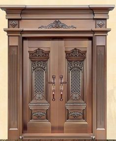 an ornate wooden door with two sidelights