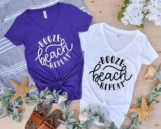 two t - shirts with the words booze beach written on them