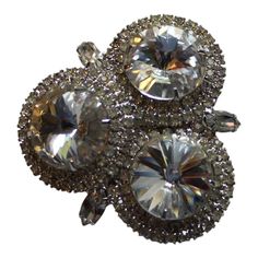 "Impressive Vintage Rhinestone Brooch/Pin 1950 Bridal Pin Rhinestone Pin Holiday Pin Three large faceted glass rivoli rhinestones are showcased in this silver tone setting brooch. Two rows of petite round glass rhinestones surround each stone and three marquis shaped glass rhinestones serve as accents .It measures 2\" in diameter . Safety clasp closure. Unsigned Beauty!" Wedding Crystal Brooches With Sparkling Stones, Wedding Brooches With Rhinestones, Vintage Jeweled Crystal Brooches, Vintage Crystal Jeweled Brooches, Party Crystal Brooch Jewelry, Crystal Rhinestone Brooches For Costume Jewelry, Glamorous Rhinestones Brooches For Party, Crystal Rhinestone Brooches Costume Jewelry, Glamorous Rhinestone Wedding Brooches