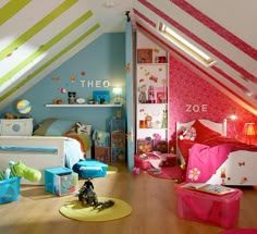 a bedroom with pink, green and blue decor on the walls is pictured in this image