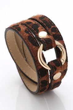 Leopard multi-strapped bracelet with gold detail. Adjustable Brown Leather Bracelet With Belt Detail, Adjustable Brown Leather Belt Bracelet, Adjustable Gold Leather Bracelet Chic Style, Adjustable Gold Leather Chic Bracelet, Trendy Brown Bracelet As Fashion Accessory, Trendy Gold Leather Bracelet, Adjustable Multi-strand Bracelet, Trendy Brown Bracelets As Fashion Accessory, Chic Adjustable Double Band Bracelet