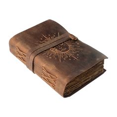 an old leather book with intricate embosishments