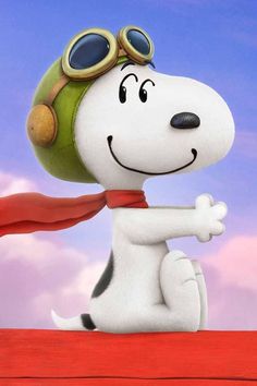 a cartoon dog with goggles and a red scarf sitting on top of a roof