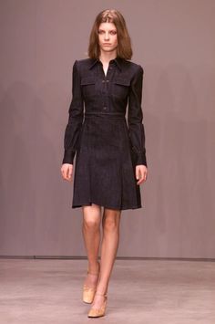 This amazing MIU MIU dress is from the Fall 2001 Collection and was featured in the runway show! *Y2K Vintage *Dark blue denim *Collared neckline *Puff sleeves *Snap button closure on bodice *Box pleat detail on skirt *Side zipper *Pockets on bodice *Knee length *100% cotton (no stretch) *'Miu Miu' brand *Excellent vintage condition  *Italian Size 44- coverts to US Size 8/Medium *Please note fit is tight in bodice area This item has been laundered and is ready to wear! Please email me with any q Fitted Long Sleeve Denim Dress For Work, Elegant Fitted Denim Dress For Fall, Fitted Denim Dress For Fall Workwear, Dark Wash Long Sleeve Dresses For Work, Dark Wash Fitted Long Sleeve Dress, Knee-length Denim Dress For Fall Workwear, Long Sleeve Dark Wash Dresses For Work, Elegant Long Sleeve Denim Dress, Fitted Long Sleeve Dark Wash Dress