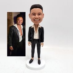 a custom bobble head with a man in a tuxedo and white shirt