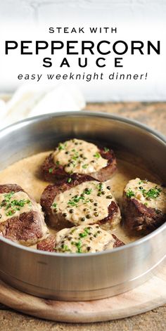 steak with peppercorn sauce in a pan on a wooden cutting board and text overlay