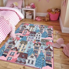 a child's bedroom with pink and blue decor