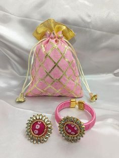 Product Item: Bangle And Ring Combo With Potli Bags 1 Piece Bangle/Kada/Bracelet  1 Piece Ring 1 Piece Potli Bag Total Quantity - 3 Piece Color - Assorted will be send Our Bangle and Ring Set with Potli Bag is a perfect wedding combo favor. Ideal for housewarming parties and a thoughtful gift for guests, this set is also great for bridesmaids. Whether for a Haldi, Mehndi party, or bridal shower, it adds a traditional touch to any celebration. Festive Multicolor Potli Bag Gift, Cheap Multicolor Potli Bag For Gift, Intricate Embroidery Potli Bag For Festivals And Gifts, Wedding Diwali Potli Pouch Bag, Traditional Handheld Potli Gift Bag, Mehndi Party, Potli Bags, Elegant Wedding, Wedding Shop