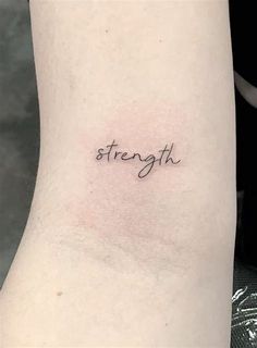 the word strength is written in cursive font on the left side of the arm