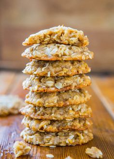 a stack of oatmeal cookies sitting on top of a wooden table