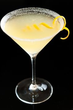 a martini with lemon garnish on the rim