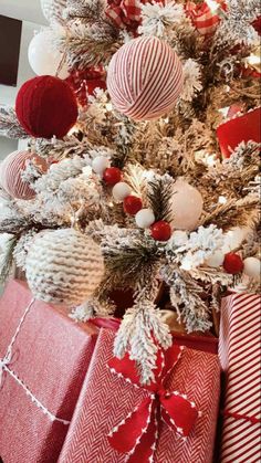 a christmas tree decorated with red and white ornaments