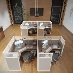 an office cubicle with desks and computers