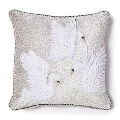 two white swans on a silver pillow