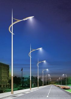 an empty road with street lights on both sides