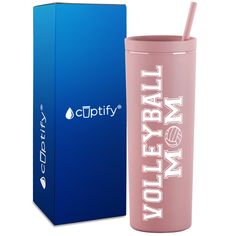 a pink tumbler next to a blue box