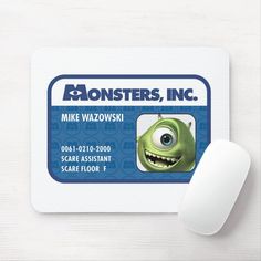 a mouse pad with a cartoon character for monsters, inc on it next to a computer mouse