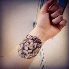 a lion tattoo on the arm