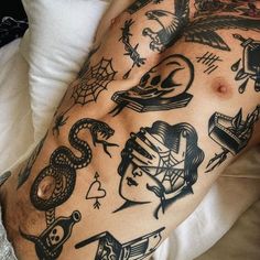 a man with many tattoos on his arm