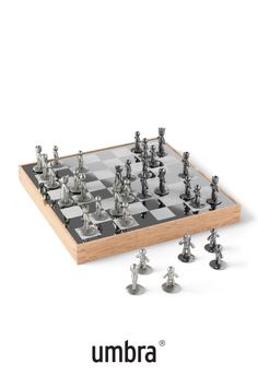 an image of a chess board with silver pieces on it and the words umbra