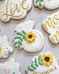 decorated cookies with the words love, me, and princess written in gold on them