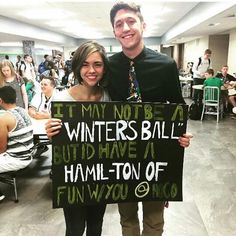 a man and woman holding up a sign that says it may not be winter's ball but have a half ton of fun with you