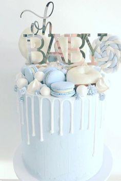 a blue and white cake with the words baby on it