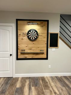 a dart board mounted to the side of a wall