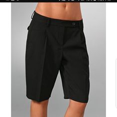 Black Bermuda Shorts Pleating And Slant Pockets At The Front, Flap Back Packets. Extended Tab, Single Closure Elegant Black Shorts For Office, Elegant Black Office Shorts, Black Short Length Bottoms For Office, Fitted Black Shorts For Business Casual, Maroon Shorts, Capri Shorts, Grey Flats, Beige Shorts, Knee Length Shorts