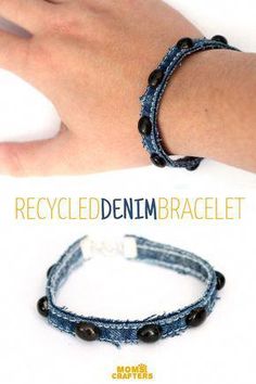 the bracelet is made out of recycled denim and has black beads on it, as well as a white bead