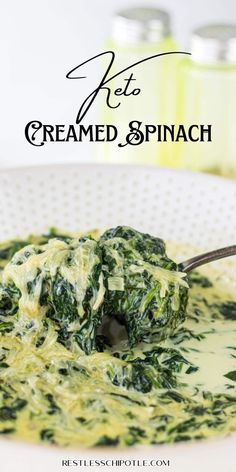 spinach and cheese soup in a white bowl with a spoon on the side that says, creamed spinach