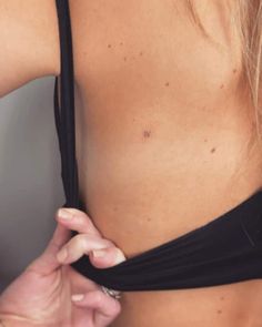 a close up of a person wearing a bra