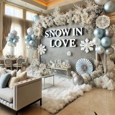 a room decorated with balloons, snowflakes and decorations for a winter themed party