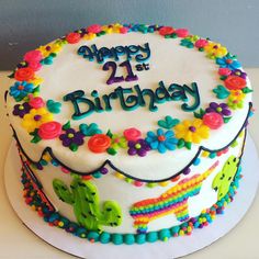 a birthday cake decorated with colorful flowers and the words happy 21st birthday written on it