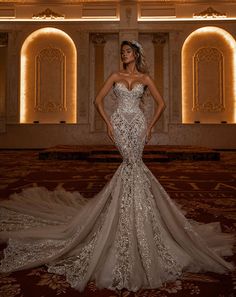 a woman in a wedding dress posing for the camera