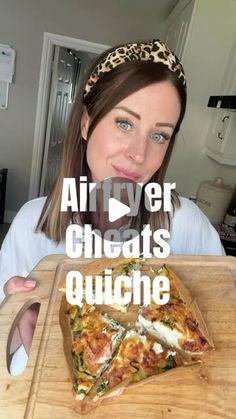 a woman holding a wooden cutting board with a slice of pizza on it and the words air fryer cheesy quiche