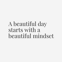 a beautiful day starts with a beautiful mindset quote on white background, black and white photograph