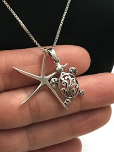 "Sterling Silver Filigree Turtle and Starfish Charm Necklace Great gift for beach lover. Metal: All components are made from solid .925 Sterling Silver Measurement: Turtle height is 25mm (0.98\") and 14mm (0.55\") wide ; Starfish height is 31mm (1.2\") and 21mm (0.83\") wide Choose Chain Length You can find other charm jewelry in my shop here https://www.etsy.com/shop/LinksAndStones?ref=seller-platform-mcnav&section_id=24389019 Please feel free to Convo me with any questions before purchasin Silver Jewelry With Starfish Charm For The Beach, Starfish Charm Strand Jewelry Gift, Starfish Charm Strand Jewelry For Gift, Silver Starfish Jewelry For Vacation, Silver Starfish Jewelry For Beach, Nickel-free Star Jewelry For The Beach, Nickel-free Star-shaped Jewelry For The Beach, Nickel-free Star-shaped Beach Jewelry, Beach Jewelry With Sterling Silver Star