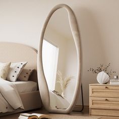 a bed room with a large mirror on the wall