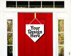 a red door with a sign hanging from it's side that says your design here