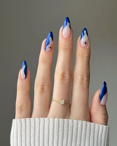 If you loved the color of the previous nails but want that extra somethin’ somethin’ to make your mani stand out, then this winter nail design is IT. The bright blue polish speaks for itself, while the wavy tips and celestial details add a whimsical touch. Blue Christmas Nails, Nails Yellow, February Nails, Blue Nail, Nail Swag, Prom Nails, Xmas Nails, Cute Acrylic Nails