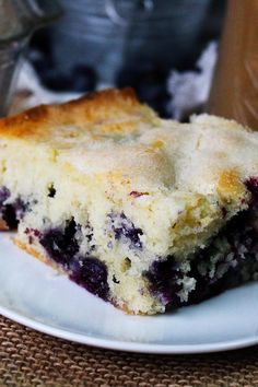 a piece of blueberry coffee cake on a plate