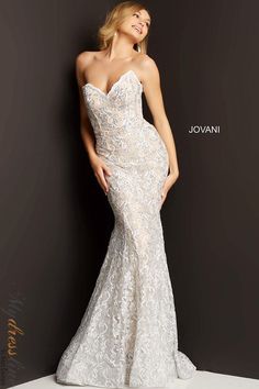 Looking for the perfect prom dress? Check out Jovani 08215! This gorgeous lace dress is embellished with intricate details that are sure to make you stand out on your big night. From the Spring 2022 collection, this dress is perfect for any formal occasion. Shop now and find your perfect fit! Stretch Lace Dress, Mermaid Gown Prom, Beaded Mermaid, Mermaid Prom Dress, Exquisite Gowns, Column Skirt, Lace Prom Dress, Lace Strapless, Lace Mermaid