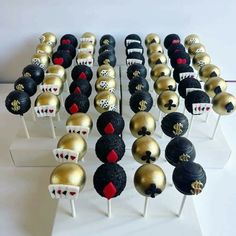 there are many black and gold cake pops