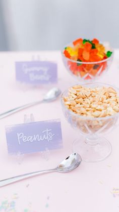 a bowl of cereal sitting on top of a table next to spoons and forks