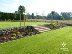 a large grassy field with steps leading up to it