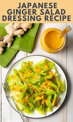 a white plate topped with lettuce and cheese next to a glass of orange juice