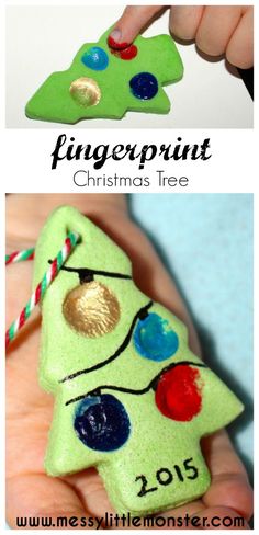 a hand holding a green christmas tree ornament