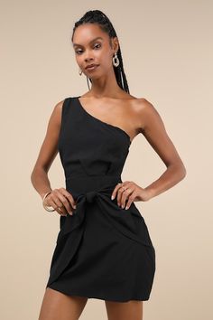 The Lulus Gorgeous Garden Black One-Shoulder Faux-Wrap Mini Dress will have you looking like an effortless dream! This cute dress is composed of woven fabric that shapes a darted bodice, a one-shoulder neckline, and a wide tank strap. Fitted waist tops a mini skirt with an overlapping panel that ties at the hip to create a faux-wrap look. Hidden side zipper/clasp. Fit: This garment fits true to size. Length: Above mid-thigh. Size medium measures 31" from shoulder to hem. Bust: Great for any cup Fitted Off-shoulder Belted Dress, Elegant One Shoulder Belted Dress, Elegant Off-shoulder Belted Dress, Elegant One-shoulder Belted Dress, Wrap-around Strap Mini Dress For Date Night, Mini Length Dress With Wrap-around Straps For Date Night, Elegant Mini Dress With Wrap-around Straps, Date Night Mini Dress With Wrap-around Straps, Chic Off-shoulder Belted Dress